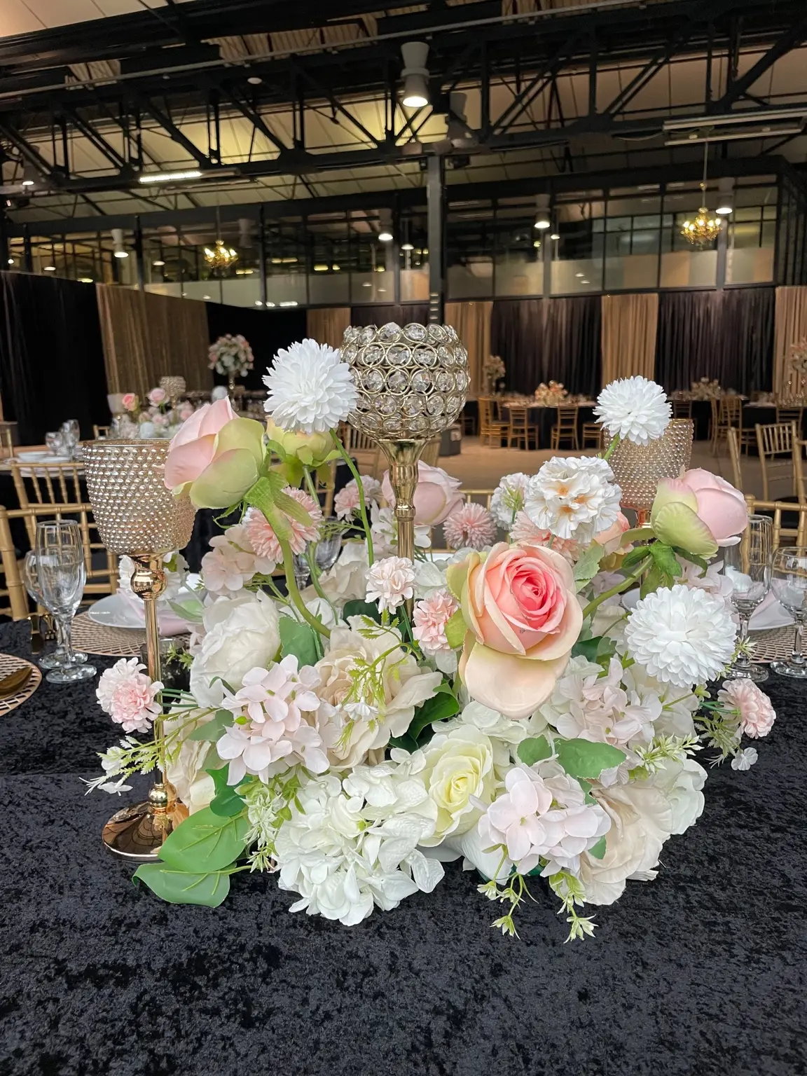 Blush and ivory floral centrepiece by Khan Events
