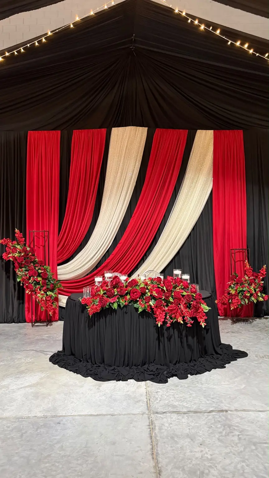 Dramatic red, black and gold wedding stage by Khan Events
