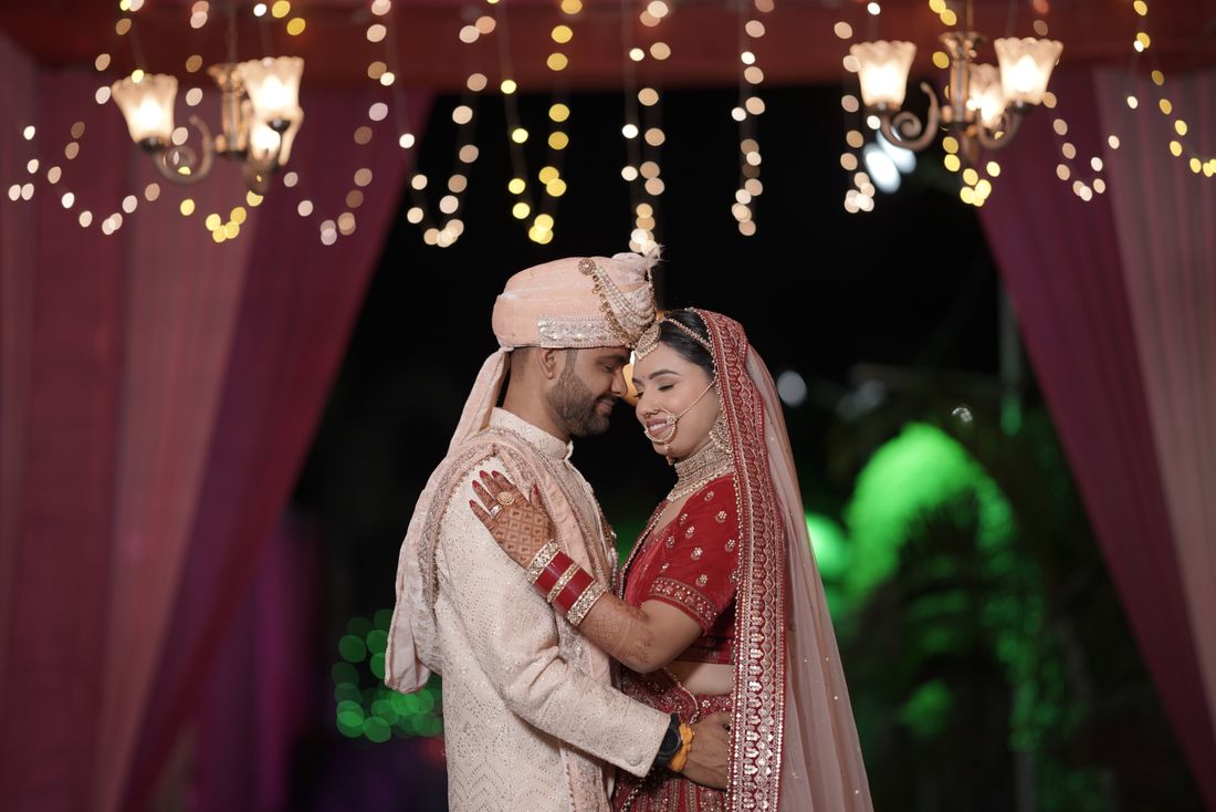 Couple celebrating in refined traditional wedding attire